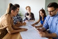 Happy multiethnic group of business people working together on meeting in office Royalty Free Stock Photo