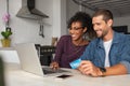 Happy multiethnic ouple making online payment