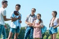 happy multiethnic teenagers playing with rugby ball