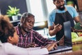 Multigenerational african american family make dinner together Royalty Free Stock Photo