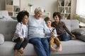 Happy multigenerational family enjoy videocall using smartphone Royalty Free Stock Photo