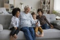 Happy multigenerational family enjoy videocall using smartphone Royalty Free Stock Photo