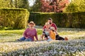 Happy multigenerational family in straw hats having fun during picnic