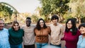 Happy multigenerational people with different ethnicities having fun together in a public park