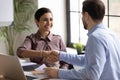 Smiling diverse businesspeople handshake closing deal at meeting Royalty Free Stock Photo