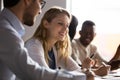 Happy multiracial colleagues talk brainstorm at office meeting Royalty Free Stock Photo