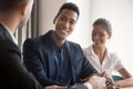 Happy multiracial couple consulting at specialist office Royalty Free Stock Photo