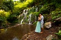 Happy multiracial couple hugging. Mixed couple in love near waterfall in tropical forest. Love story. Wana Amertha waterfall Royalty Free Stock Photo