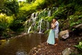 Happy multiracial couple hugging. Mixed couple in love near waterfall in tropical forest. Love story. Wana Amertha waterfall Royalty Free Stock Photo