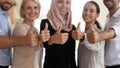 Happy multiracial diverse people showing thumbs up gesture. Royalty Free Stock Photo