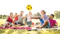 Happy multiracial families having fun with cute kids at pic nic garden party - Multicultural joy and love concept Royalty Free Stock Photo