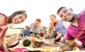 Happy multiracial families taking selfie at pic nic garden party - Multicultural joy and love concept with mixed race people Royalty Free Stock Photo