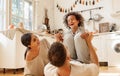 Happy multiracial family playing in kitchen