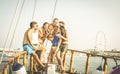 Happy multiracial friends having fun on sailing party boat Royalty Free Stock Photo