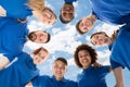 Smiling Multiracial Janitors Forming Huddle