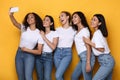 Happy Multiracial Ladies Making Selfie On Smartphone Over Yellow Background