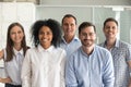 Happy multiracial professional employees looking at camera, team Royalty Free Stock Photo