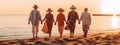 Happy multiracial senior friends having fun walking on the beach at sunset during the summer holidays