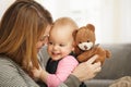 Happy mum and baby with teddy bear Royalty Free Stock Photo