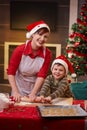 Happy mum baking with son for christmas Royalty Free Stock Photo