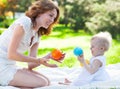 Happy mum and her Child playing in Park together Royalty Free Stock Photo