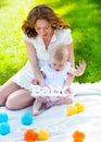 Happy mum and her Child playing in Park together Royalty Free Stock Photo