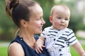 Happy mum and her child playing in park together Royalty Free Stock Photo