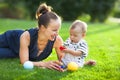 Happy mum and her child playing in park together Royalty Free Stock Photo