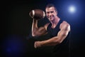 Happy muscular young man holding soccer ball Royalty Free Stock Photo