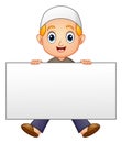 Happy Muslim boy cartoon holding blank sign Royalty Free Stock Photo