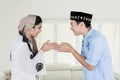 Happy Muslim couple forgiving each other at home Royalty Free Stock Photo
