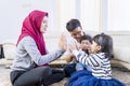 Happy muslim family clapping hands playfully Royalty Free Stock Photo