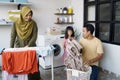 Happy muslim family doing laundry at home Royalty Free Stock Photo