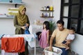 Happy muslim family doing laundry at home Royalty Free Stock Photo