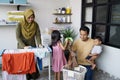 Happy muslim family doing laundry at home Royalty Free Stock Photo