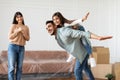 Happy muslim family having fun celebrating moving day Royalty Free Stock Photo