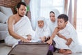 Muslim family packing for umrah and hajj