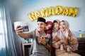 happy muslim family take selfie together in ramadan