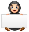 Happy Muslim girl cartoon holding blank sign Royalty Free Stock Photo