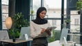 Happy muslim Islam woman Arabian girl in hijab HR manager secretary with paper tablet write notes sign data in note Royalty Free Stock Photo