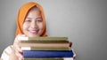 Happy Muslim Lady with Books