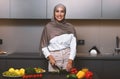 Happy Muslim Lady Cooking In Kitchen Making Salad For Dinner