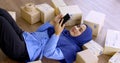 Happy muslim merchandiser woman checking online order in the office