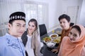 Happy Muslim people take photo in the dining room Royalty Free Stock Photo