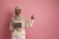 Happy Muslim Woman In Hijab Holding Digital Tablet And Pointing Aside Royalty Free Stock Photo