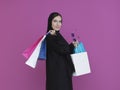 Happy Muslim woman posing with shopping bags