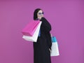 Happy Muslim woman posing with shopping bags