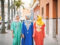 Happy muslim women walking in the city center - Arabian teen girls having fun spending time together outdoor