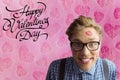 Happy nerd man with lipstick mark and valentines day text