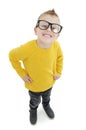 Happy nerdy boy in glasses smiling looking at camera on white background . Closeup portrait of funny school kid in glasses